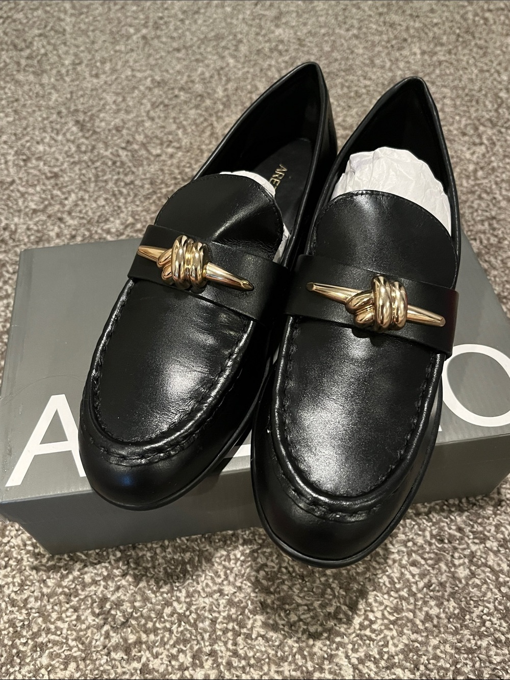 Black Leather Slip-On Loafers with Gold Knot Accent